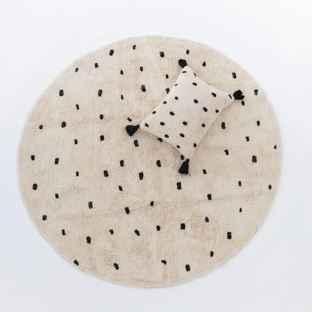 Machine Washable round rug and matching cushion by Oh Happy Home